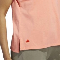 Adidas 2023 Women's Go-To Heathered Polo -Golf World Shop adidas 23 womens go to heathered polo coral fusion detail2 itempicture